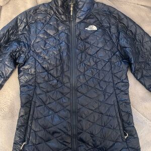 The North Face Blue Puffer Jacket with Diamond Quilting